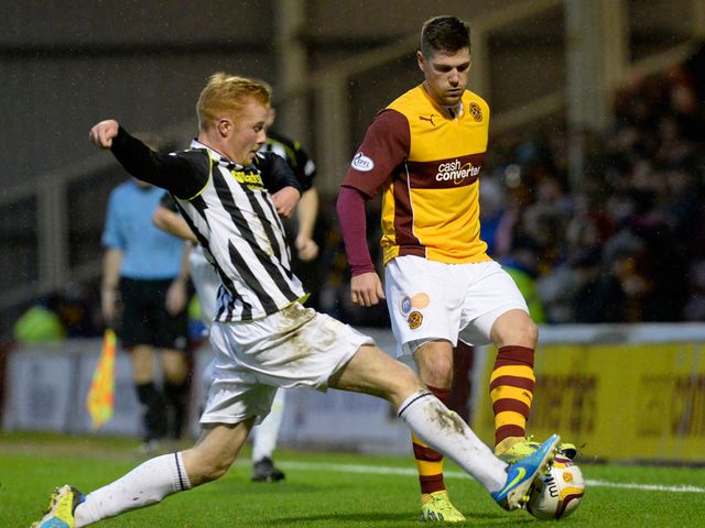 Iain Vigurs is challenged by St Mirren's Conor Newton