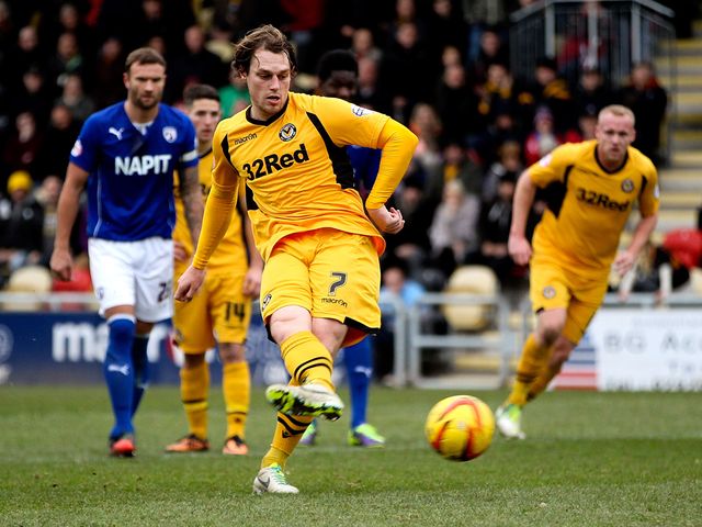 Adam Chapman scores from the penalty spot for Newport.