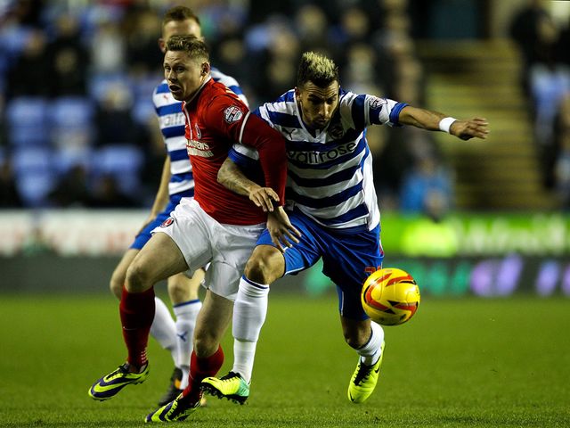 Simon Church and Danny Williams battle for possession