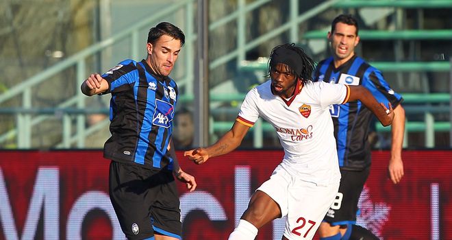Gervinho is put under pressure by Luca Cigarini