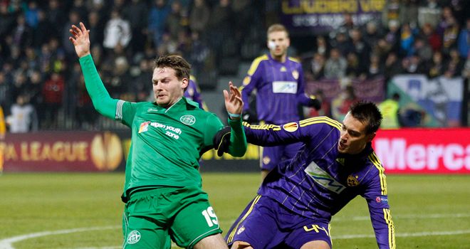 Callum McManaman is sent flying during Wigan's defeat to Maribor
