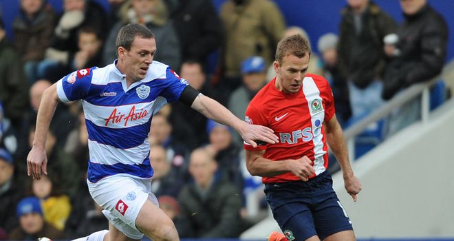 Richard Dunne challenges Jordan Rhodes for the ball