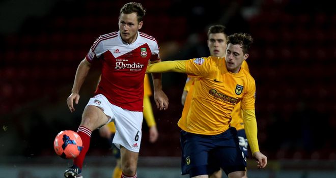 Joe Clarke: Wrexham goalscorer battles with Oxford's Scott Davies