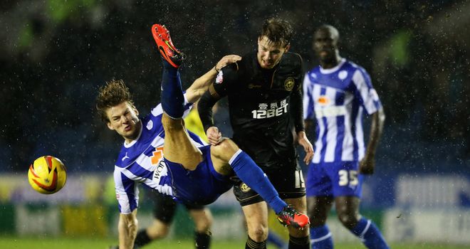 Glenn Loovens: Battles for the ball with Nick Powell of Wigan