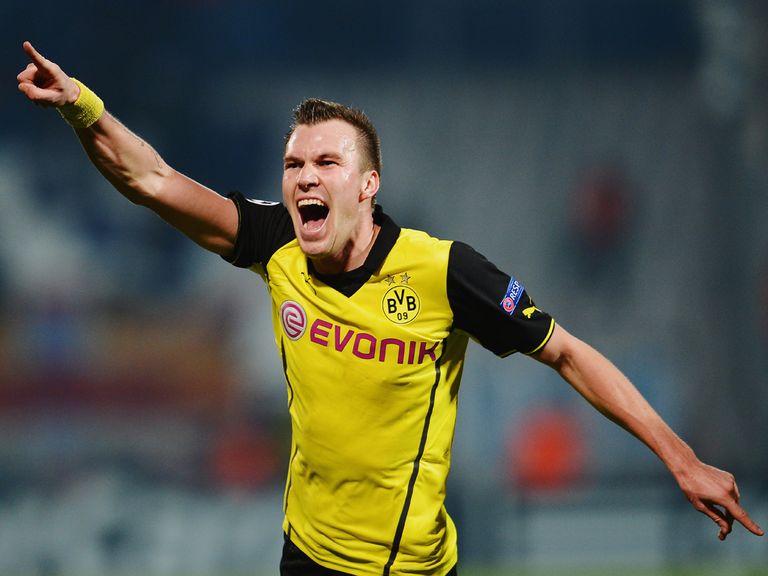 Borussia Dortmund beat Marseille 2-1 to march on in the Champions League.