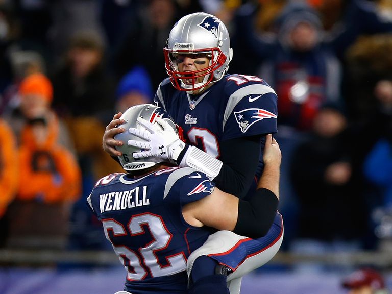 Tom Brady is lifted up to celebrate New England's win.