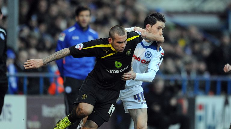 Joe Mattock (left) and Ian Henderson: Battle for the ball at Spotland