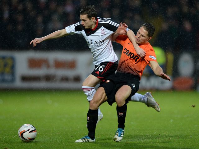 Peter Pawlett gets the better of John Rankin