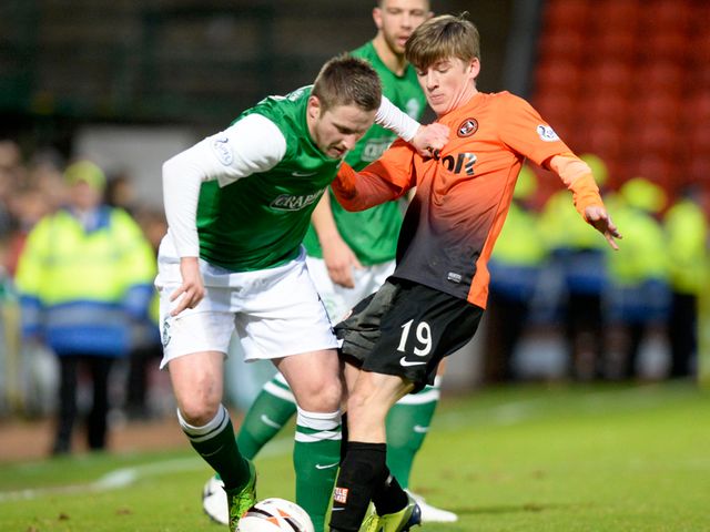Dundee Utd's Ryan Gauld (right) tackles Paul Cairney