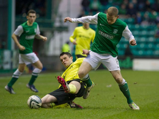 John McGinn slides in on Scott Robertson