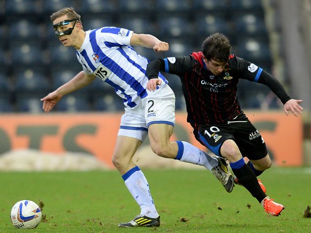 Jeroen Tesselaar skips away from Aaron Doran
