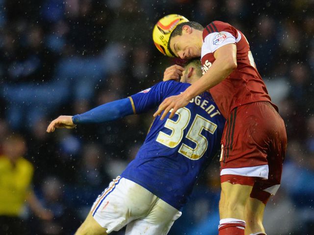 Daniel Ayala beats David Nugent to a header