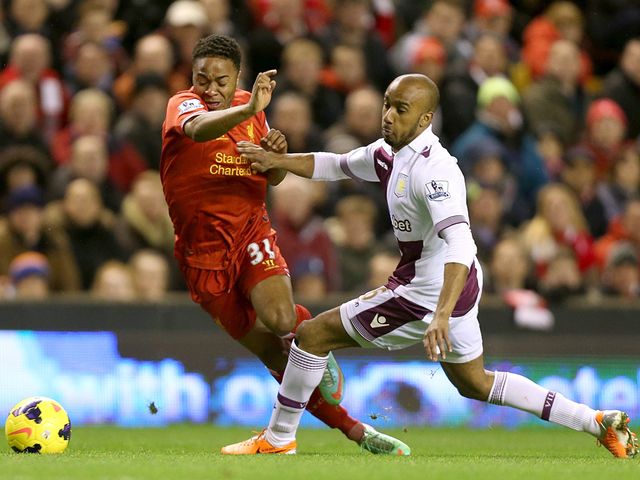 Raheem Sterling tries to avoid Fabian Delph