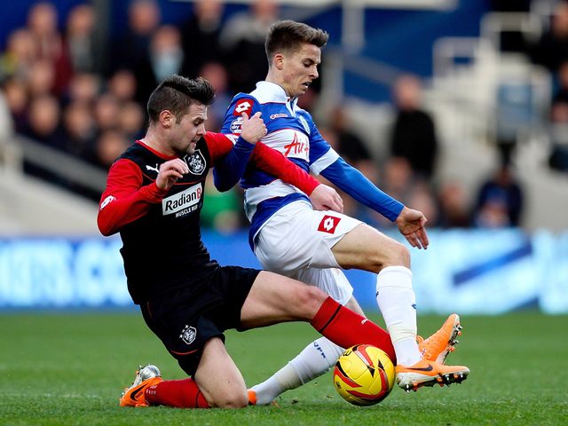 Oliver Norwood tackles Tom Carroll