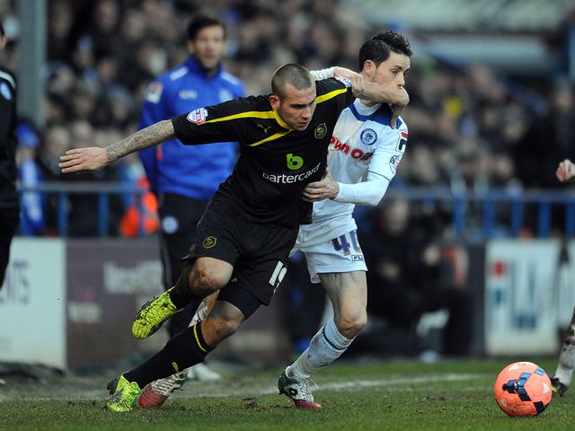 Joe Mattock and Ian Henderson battle for the ball