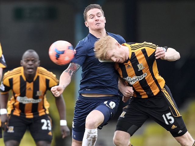 Paul McShane wins a header for Hull