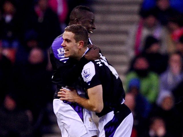 Aly Cissokho celebrates Liverpool's opener with Jordan Henderson