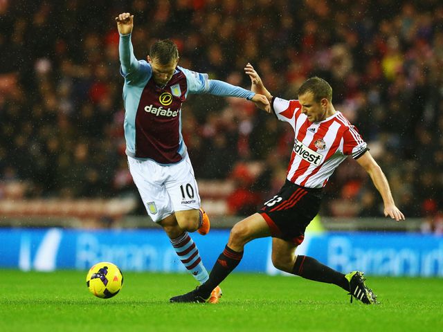 Andreas Weimann avoids Lee Cattermole