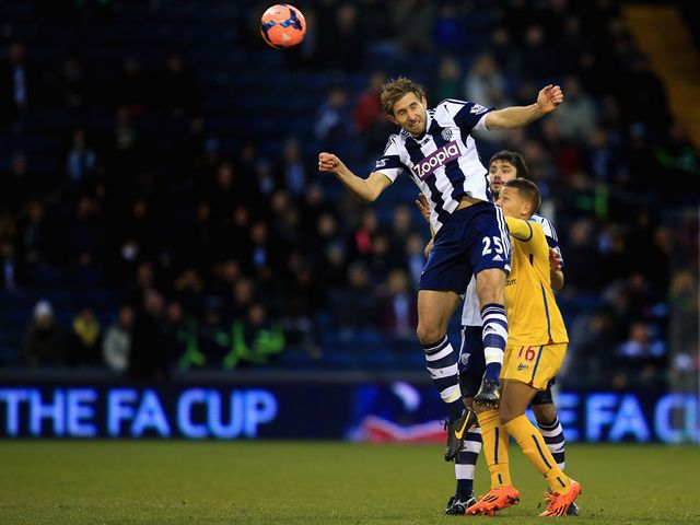 West Brom's Craig Dawson heads clear at The Hawthorns