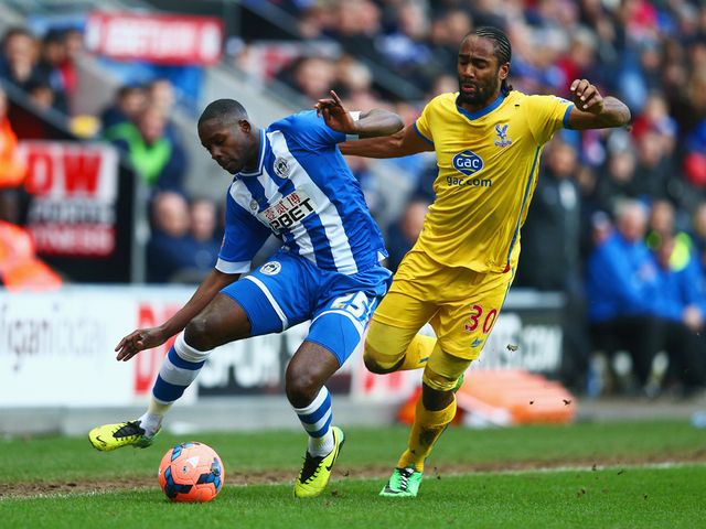 Leon Barnett keeps the ball away from Cameron Jerome