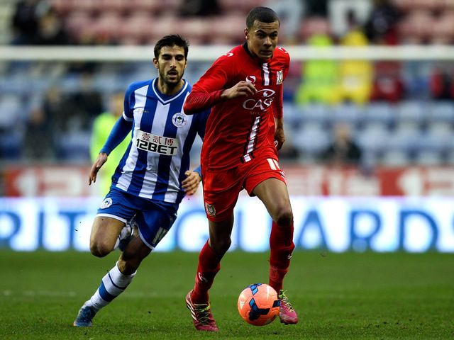 Dele Alli holds off Jordi Gomez