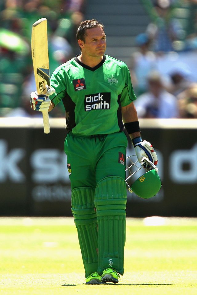 Brad Hodge celebrates his half-century against the Perth Scorchers