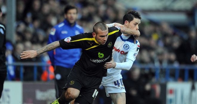 Joe Mattock (left) and Ian Henderson: Battle for the ball at Spotland