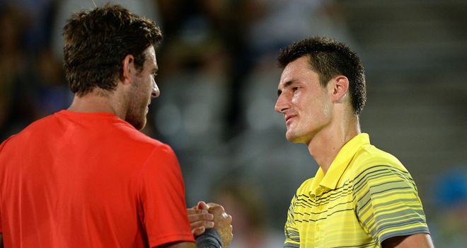 Juan Martin del Potro (l) shakes hands with Bernard Tomic following their one-sided Sydney final on Saturday