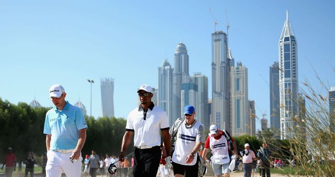 Stephen Gallacher (L) with Tiger Woods during the Champions Challenge in Dubai