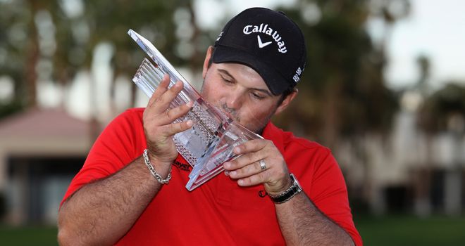 Patrick Reed kisses his trophy after winning the Humana Challenge