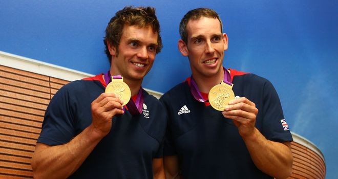 Tim Baillie and Etienne Stott pose with their Olympic gold medals