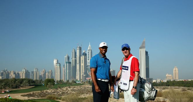 Tiger Woods poses with caddie Joe LaCava at the Emirates GC in Dubai