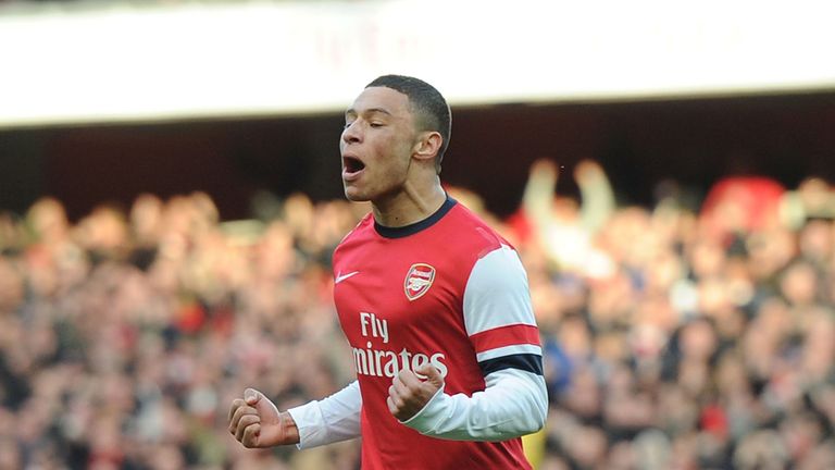 Alex Oxlade-Chamberlain: Celebrates after opening the scoring for Arsenal