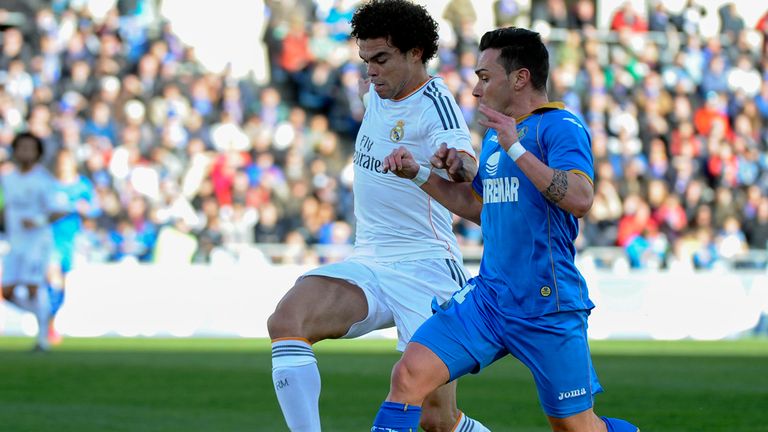 Real Madrid's defender Pepe vies with Getafe's Adrian Colunga
