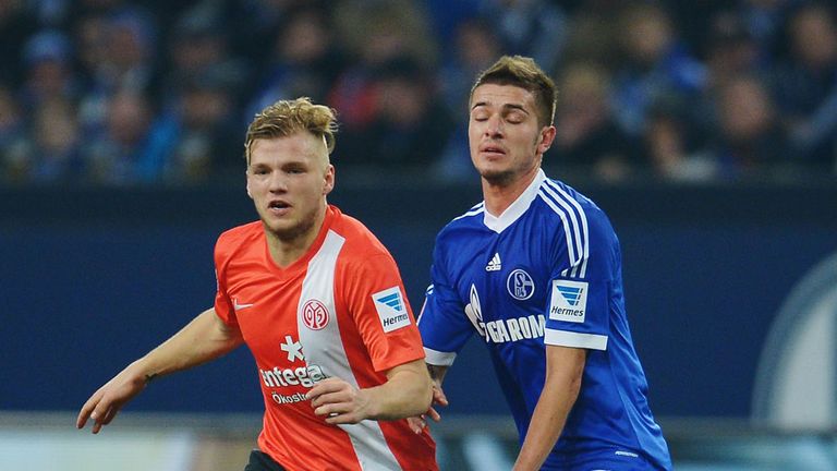 Max Meyer and Roman Neustaedter battle for the ball