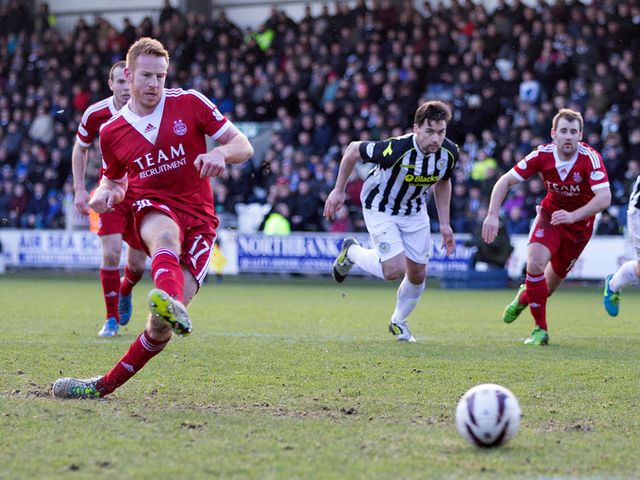 Adam Rooney strokes home Aberdeen's winning penalty