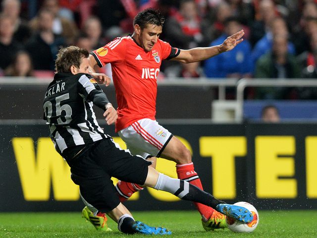 Costin Lazar tackles Eduardo Salvio