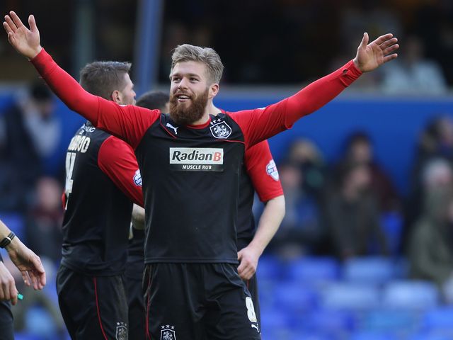 Adam Clayton celebrates his Huddersfield goal