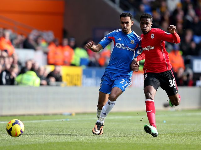 Ahmed El Mohamady of Hull battles with Wilfried Zaha of Cardiff