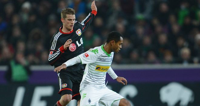 Lars Bender tries to tackle Raffael