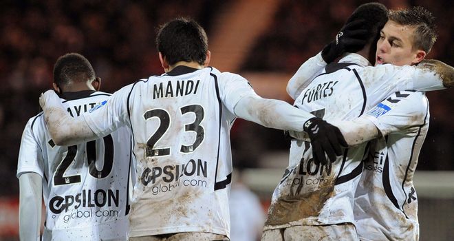 Odair Fortes is mobbed by teammates after his goal