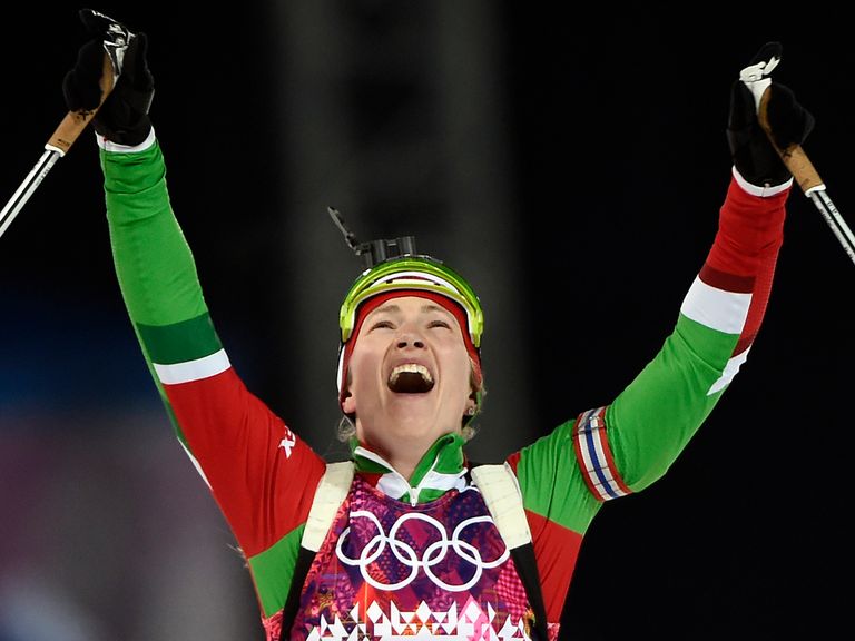 Darya Domracheva celebrates after clinching her third gold medal