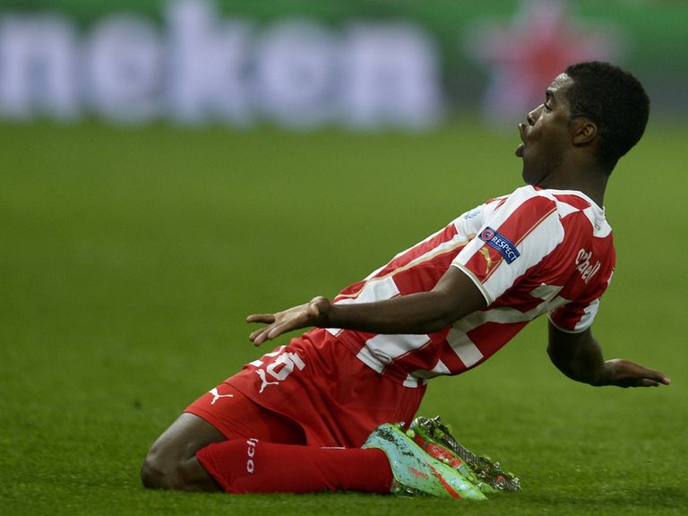 Joel Campbell: Olympiakos' on-loan Arsenal man celebrates his strike against Manchester United