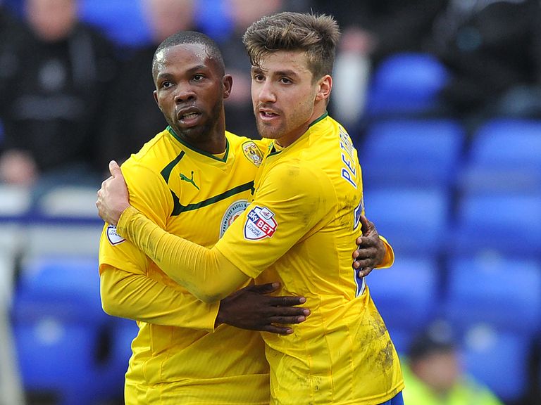 Coventry City's Mike Petrasso (right) is congratulated