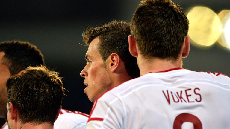 Gareth Bale congratulated after netting Wales' third goal
