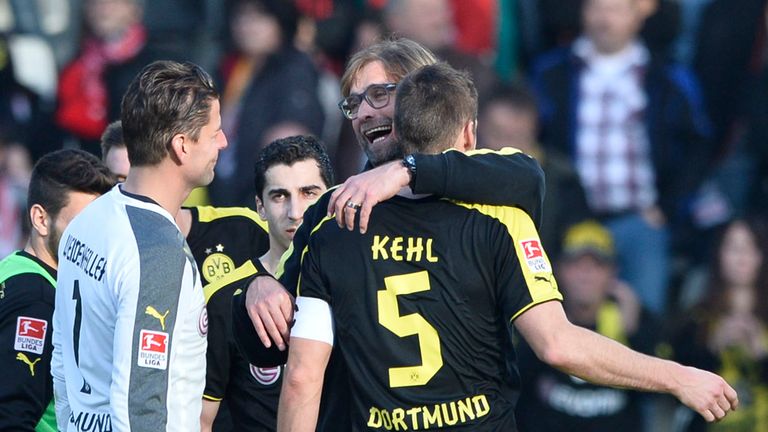 Dortmund boss Jurgen Klopp hugs Sebastian Kehl