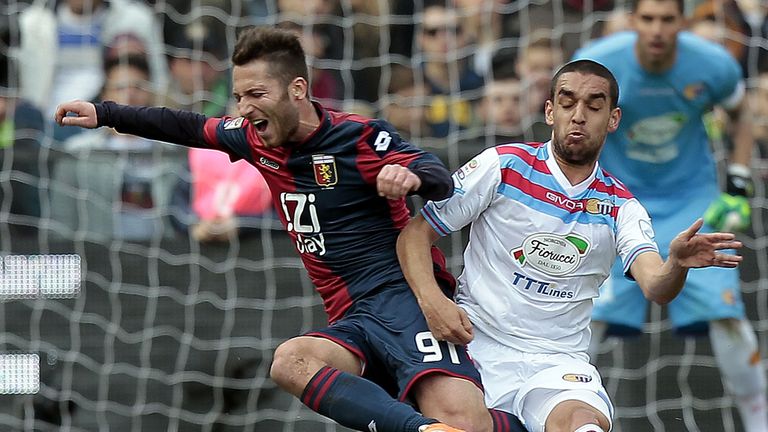 Andrea Bertolacci tumbles to the ground