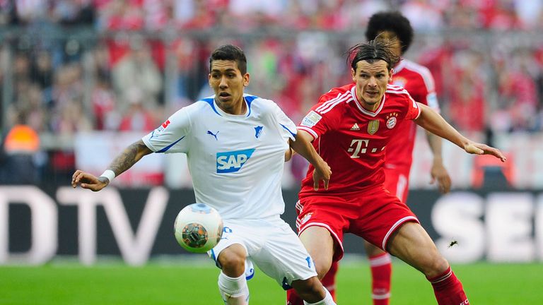 Roberto Firmino holds off Daniel van Buyten