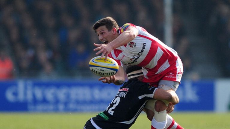 Gloucester's Ryan Mills gets a pass away under pressure
