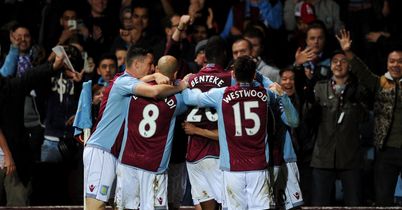Fabian Delph: The man in the middle is mobbed by Villa players in a shock 1-0 win